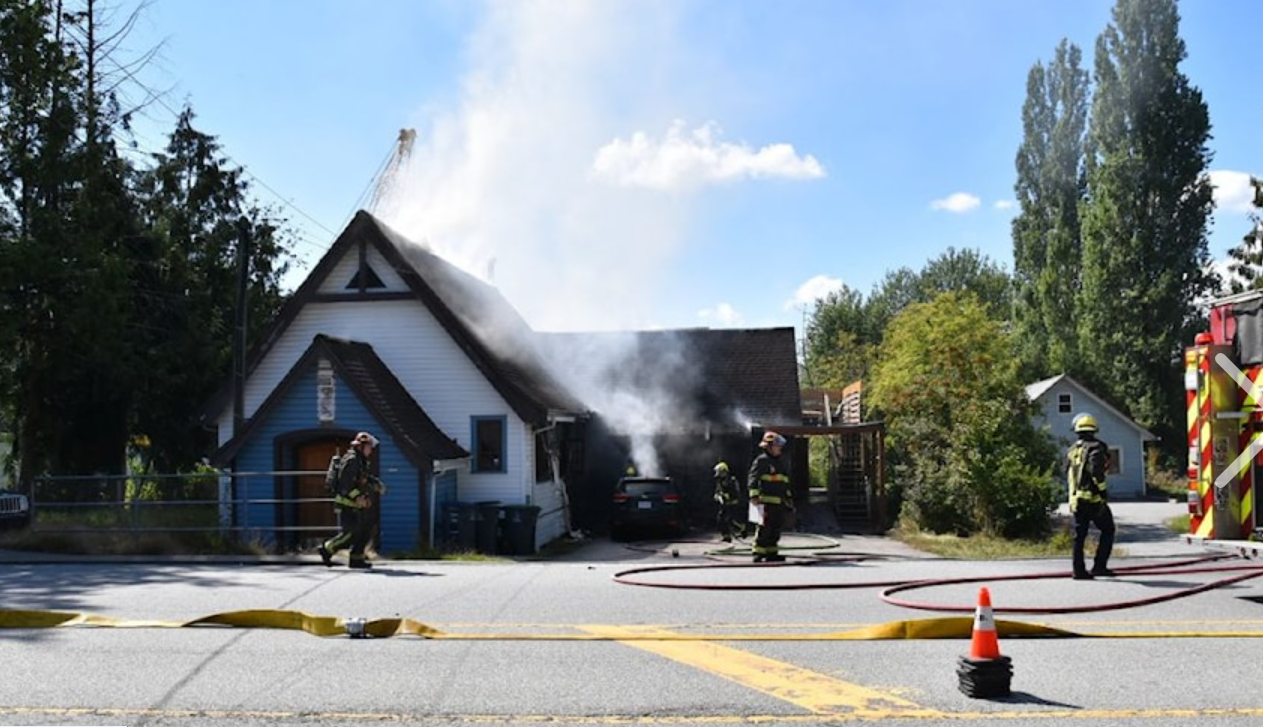 Firefighters fight an inferno tearing through the former Surrey Little Theatre building on 184 Street in Clayton Heights