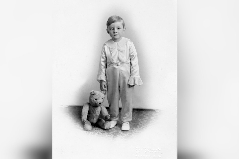 Eric Neville Dennison is shown in 1910 with his teddy bear
