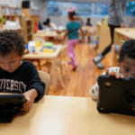 Children work on tablets