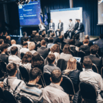 Business owners and entrepreneurs attending the Delta Business Builders Summit 2025 in Surrey, captured during a panel discussion covered by Surrey Speak.