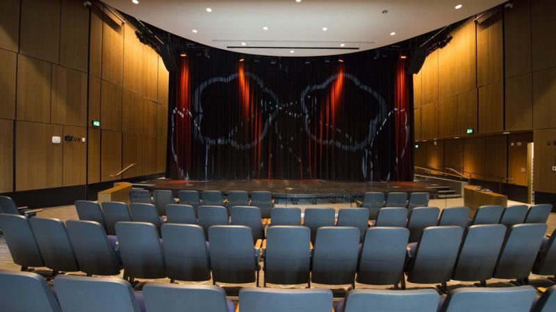Interior view of Surrey Civic Theatres showing the Main Stage, seating area, and stage lighting, used by Surrey Speak to highlight upcoming theatre events.