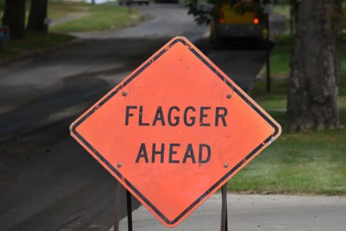 Surrey Speak – ‘Flagger Ahead’ road sign used to illustrate Surrey council’s approval of a $4.75M annual contract for traffic control and flagging services.