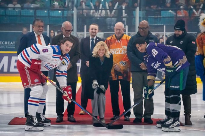 Mayor Brenda Locke joins Surrey Eagles Punjabi Night ceremonial puck drop with players and community leaders at South Surrey Arena.