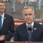 Prime Minister Mark Carney speaking at a northern B.C. grid expansion announcement, outlining the North Coast Transmission Line plan alongside federal officials.