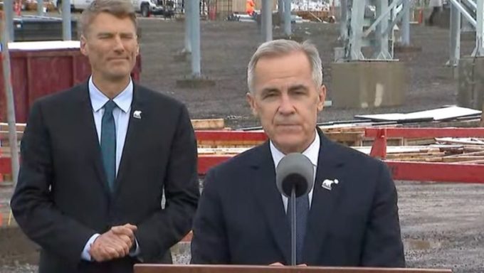 Prime Minister Mark Carney speaking at a northern B.C. grid expansion announcement, outlining the North Coast Transmission Line plan alongside federal officials.