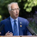 John Rustad speaks outdoors at a press conference as internal tensions rise within the B.C. Conservative Party.
