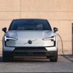 A modern electric vehicle charging at a public charging station in British Columbia, illustrating the province’s revised EV sales targets and policy changes.