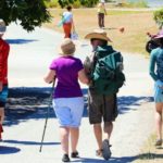 People walking along the main path at Crescent Beach in Surrey with a leashed dog, reflecting Surrey Speak coverage of the city’s new year-round dog access rules.