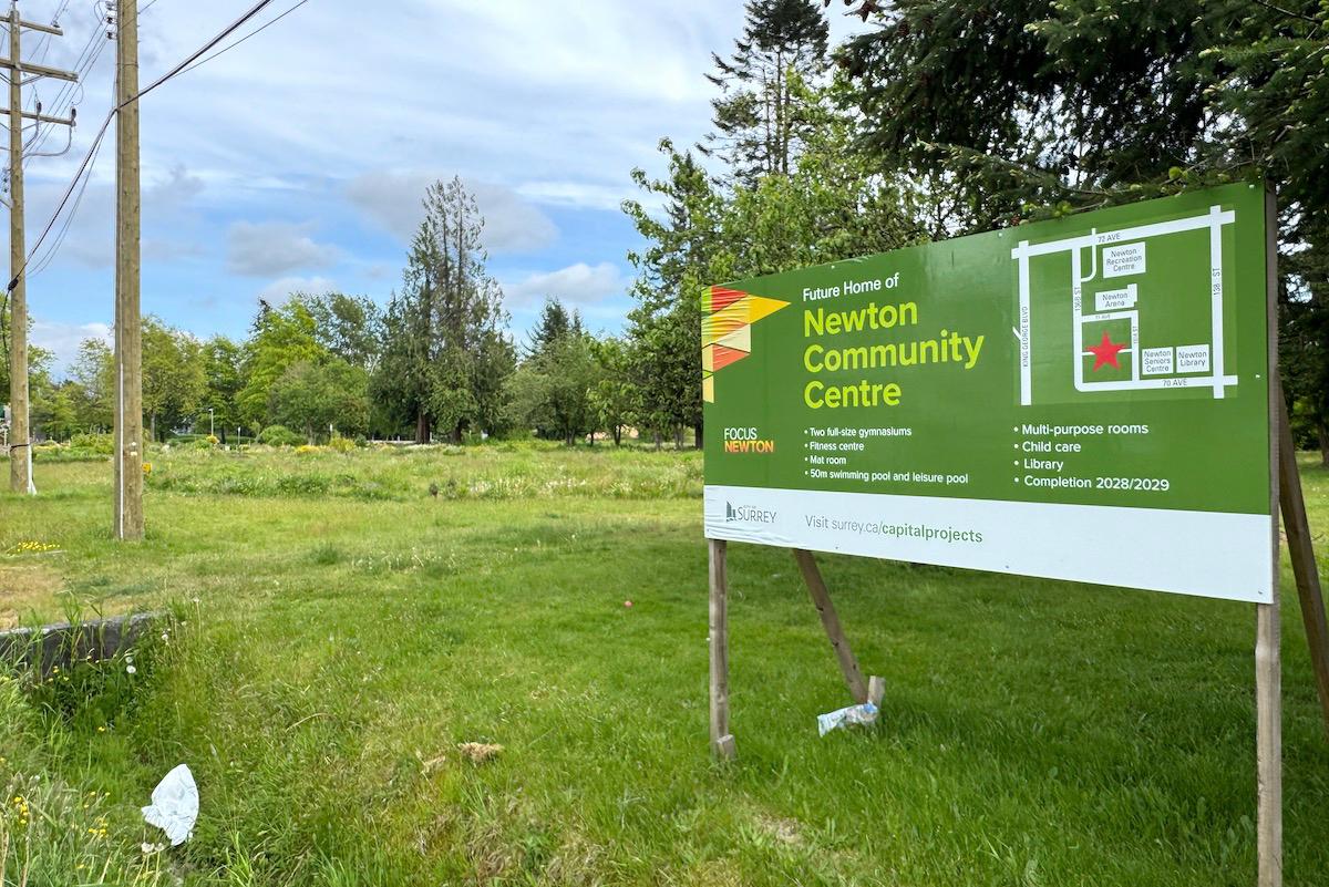 Sign marking the future home of the Newton Community Centre on the current PLOT community garden site in Surrey, captured for Surrey Speak’s coverage of the Newton Town Centre redevelopment plan.