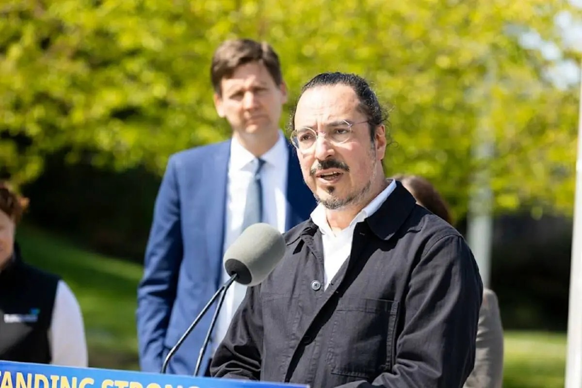 Dr. Daniel Vigo speaks at a Surrey news conference alongside Premier David Eby while discussing new B.C. legislation protecting health-care workers who provide involuntary psychiatric care.