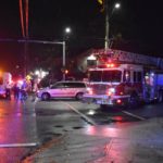 Emergency crews, fire truck, and ambulance at Surrey Fraser Heights intersection after a three-year-old child was struck by a minivan | Surrey Speak news coverage.