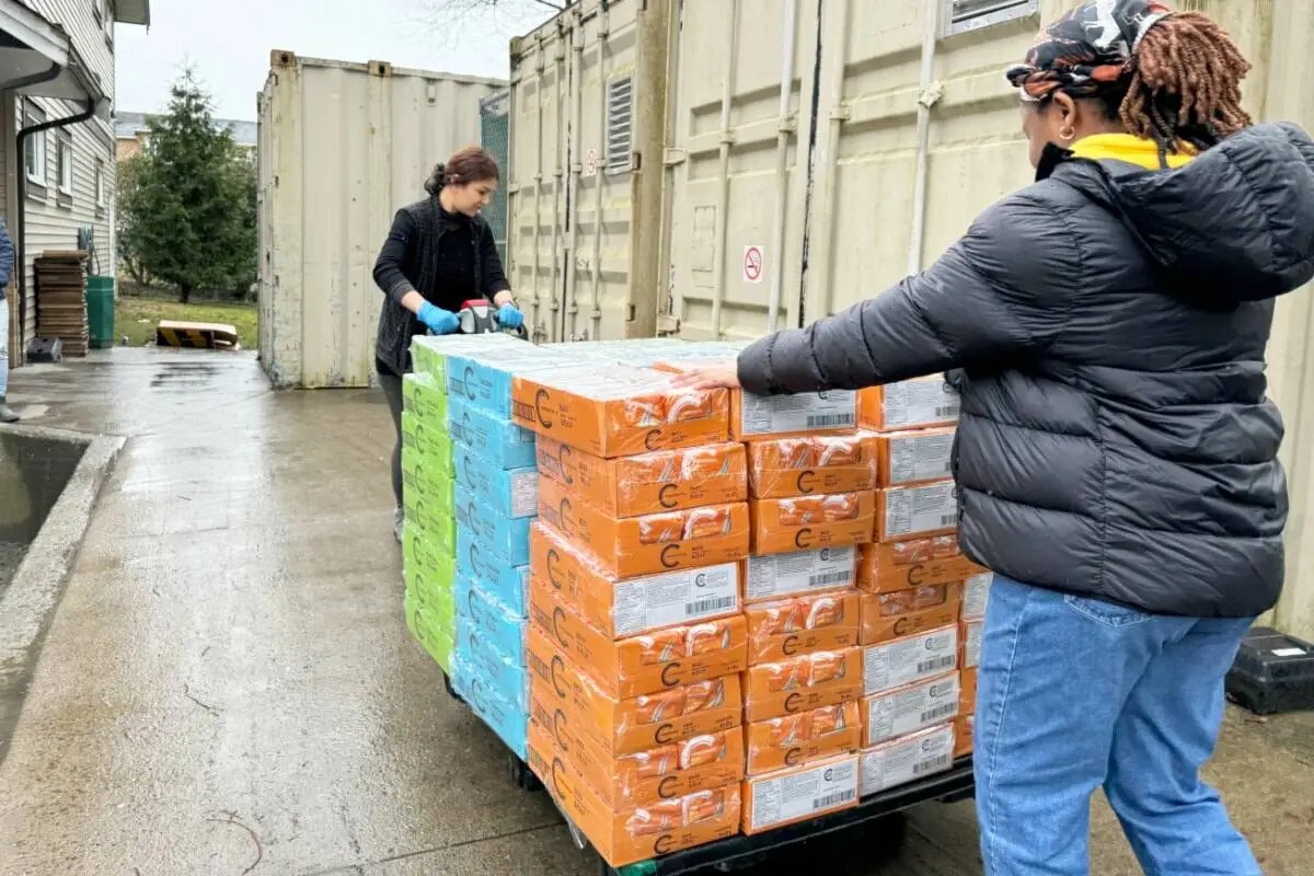 Volunteers move large stacks of boxed food at St. Joseph’s Food Bank in Mission during donation shortages, used by Surrey Speak for reporting on the $100,000 shortfall.