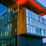 Surrey City Hall exterior at dusk, showing the glass façade and modern architecture associated with the city’s financial operations.