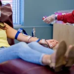 A woman donates at a Canadian Blood Services clinic.