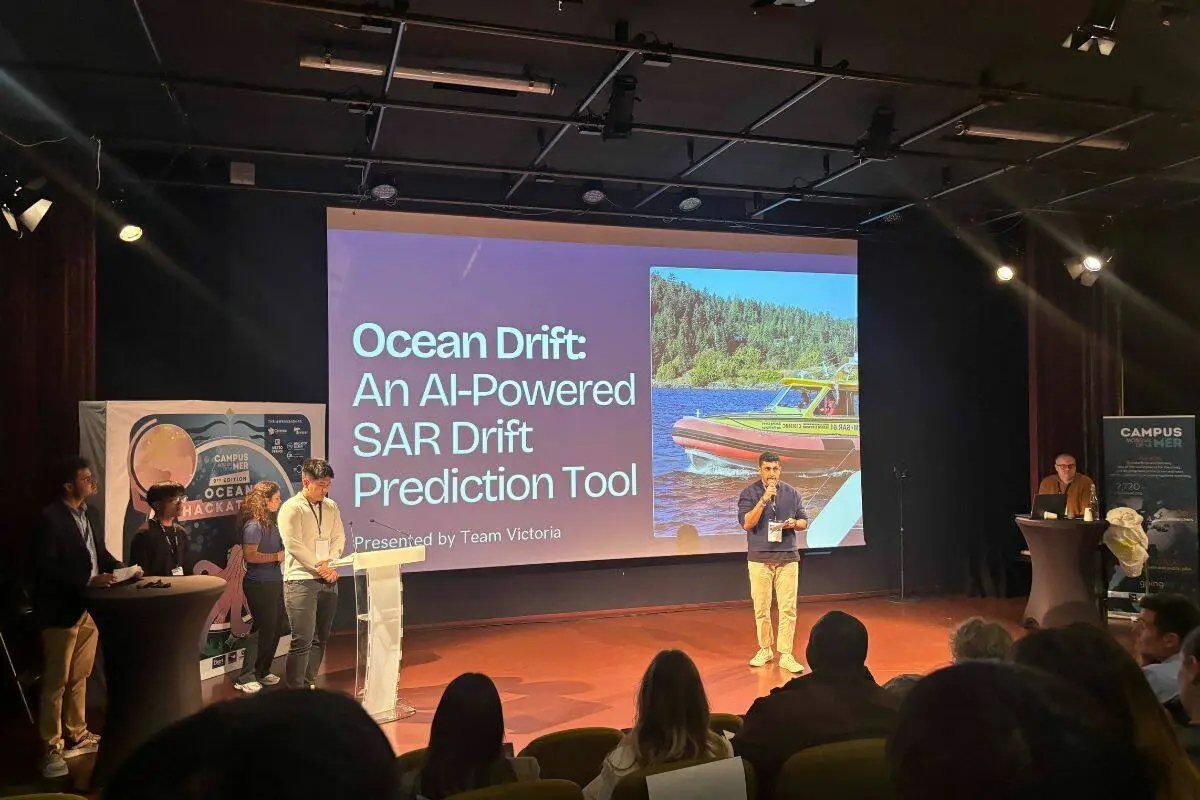 Students present their Ocean Drift AI-powered search-and-rescue drift prediction tool on stage at the global Ocean Hackathon finals in France.
