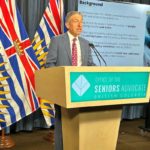 B.C. Seniors Advocate Dan Levitt speaks at podium for Coffee Social chats in Surrey with B.C. Seniors Advocate Dan Levitt Jan. 26.