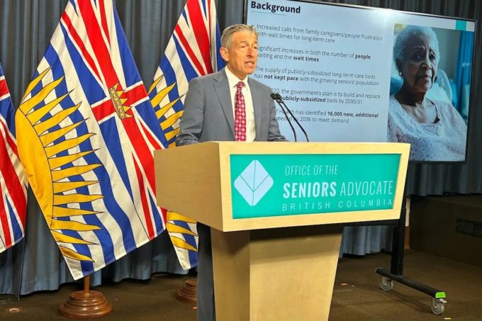 B.C. Seniors Advocate Dan Levitt speaks at podium for Coffee Social chats in Surrey with B.C. Seniors Advocate Dan Levitt Jan. 26.