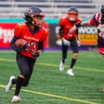Cloverdale U12 Bobcats running back carries the football past a Southside Dawgs defender during the provincial championship game.