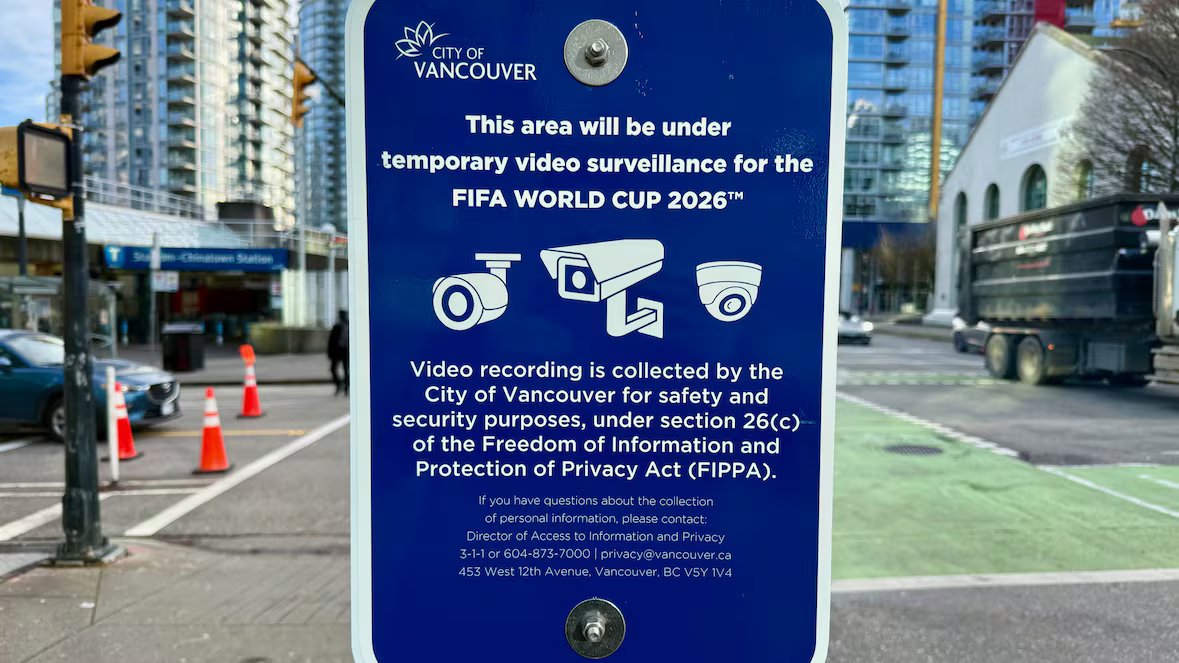 A blue City of Vancouver sign posted near the Stadium