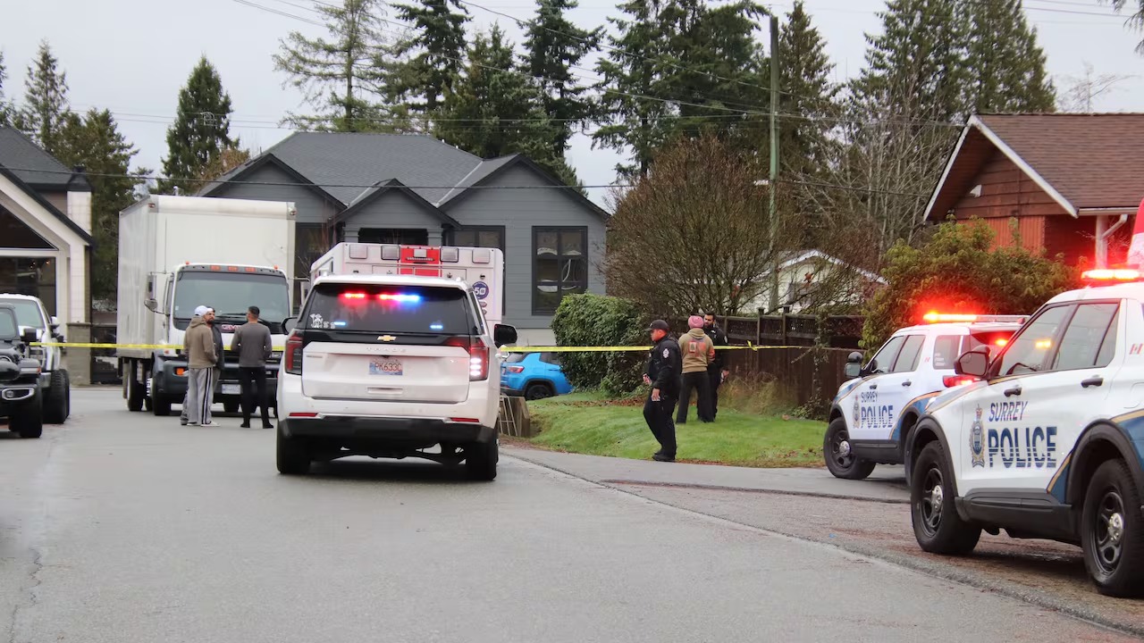 Police and emergency vehicles block a residential street in Surrey’s Newton neighbourhood after a serious collision involving a child and a large cube van.