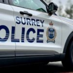 Surrey RCMP police vehicle investigates three shots fired at Guildford residence, RCMP SPOSU leads probe.