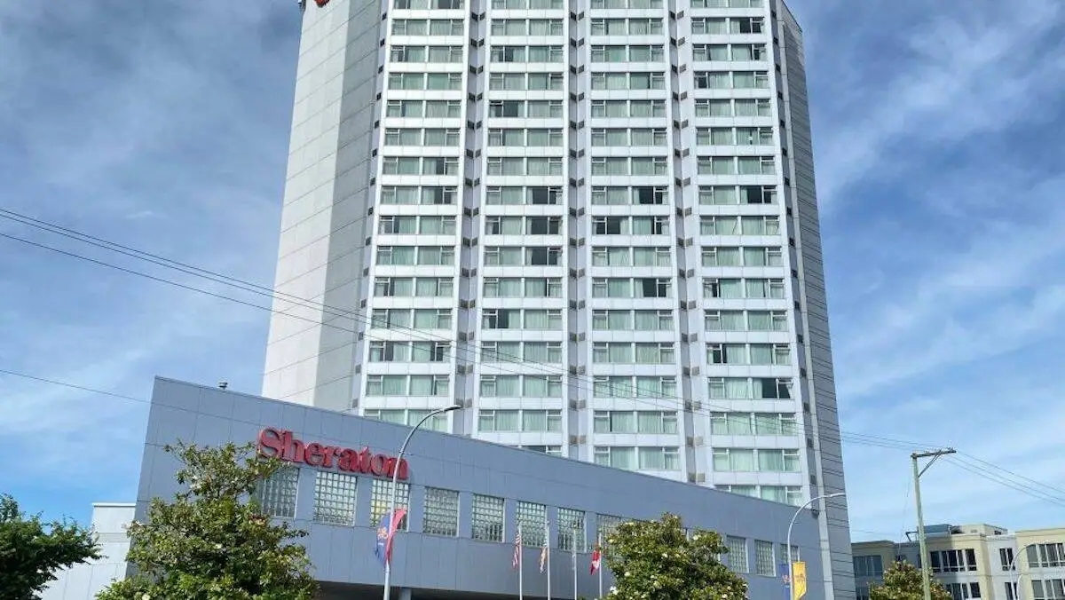 Exterior view of the Sheraton Vancouver Guildford Hotel tower in Surrey on a clear day.