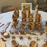 Olive-wood nativity figures, camels and small carvings from Palestinian artisans displayed on a table at a South Surrey craft fair fundraiser.