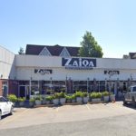 Street-view of a one-storey Surrey strip mall with Zaiqa restaurant and parking in front.