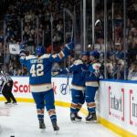 Vancouver Goldeneyes players celebrate a goal in front of a loud home crowd at Pacific Coliseum during their inaugural PWHL season.