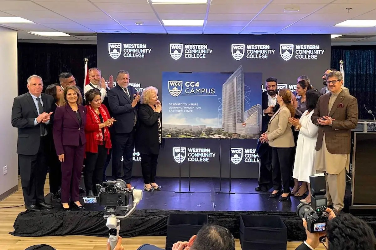 Leaders applaud at Western Community College CC4 campus unveiling.