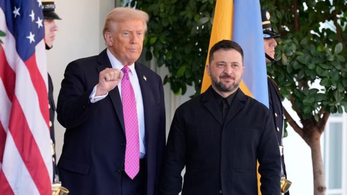 U.S. and Ukrainian leaders stand side by side in front of their national flags during a formal photo op.