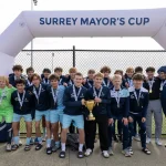 A trophy-winning team at the 2025 Surrey Mayor’s Cup soccer tournament
