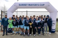 A trophy-winning team at the 2025 Surrey Mayor’s Cup soccer tournament