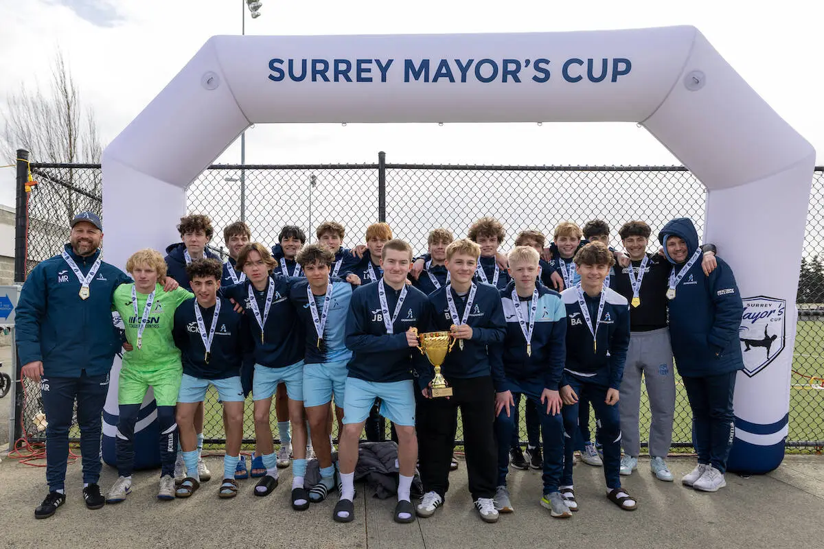 A trophy-winning team at the 2025 Surrey Mayor’s Cup soccer tournament