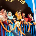 Woman on the Guru Angad Dev Elementary School float in the Vaisakhi parade in Surrey