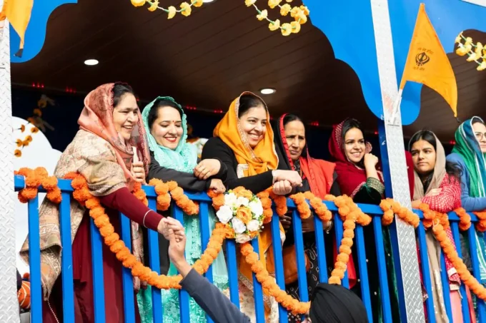Woman on the Guru Angad Dev Elementary School float in the Vaisakhi parade in Surrey