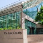 Exterior view of the British Columbia Law Courts building in Vancouver, featuring glass architecture and courthouse entrance
