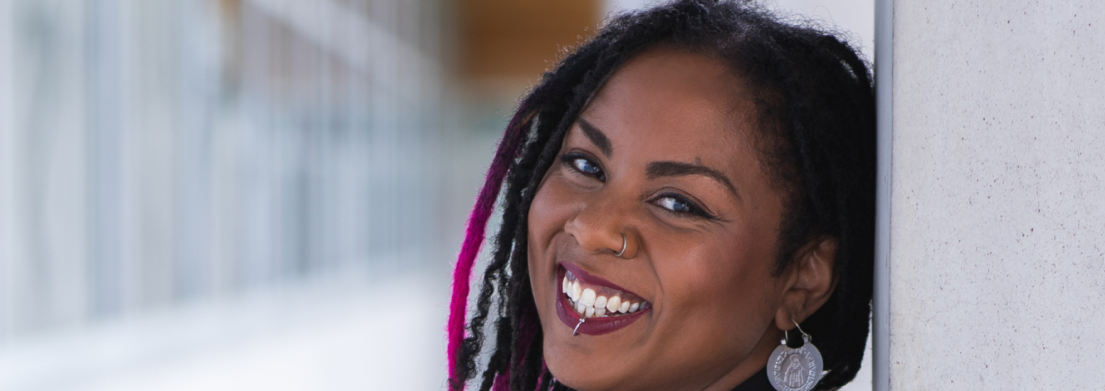 Afro-Latina artist and author Ruby Smith Díaz smiles during a portrait photo ahead of her Afrofuturism speaker session hosted by the City of Surrey.