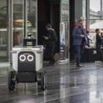 Screenshot of a City of Surrey social media post showing an autonomous food delivery robot demonstration at Surrey City Hall.