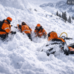 A 23-year-old man has died in an avalanche while snowmobiling near Kootenay Pass, B.C., as rescue crews urge backcountry caution amid high risk.