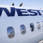 WestJet airplane at Vancouver International Airport after delay caused by unruly passengers
