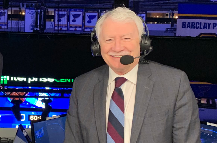 John Garrett Vancouver Canucks broadcaster smiling during a hockey broadcast