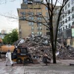 Memorial scene remembering victims of the Winters Hotel fire in Vancouver, with candles and community members gathered in reflection.