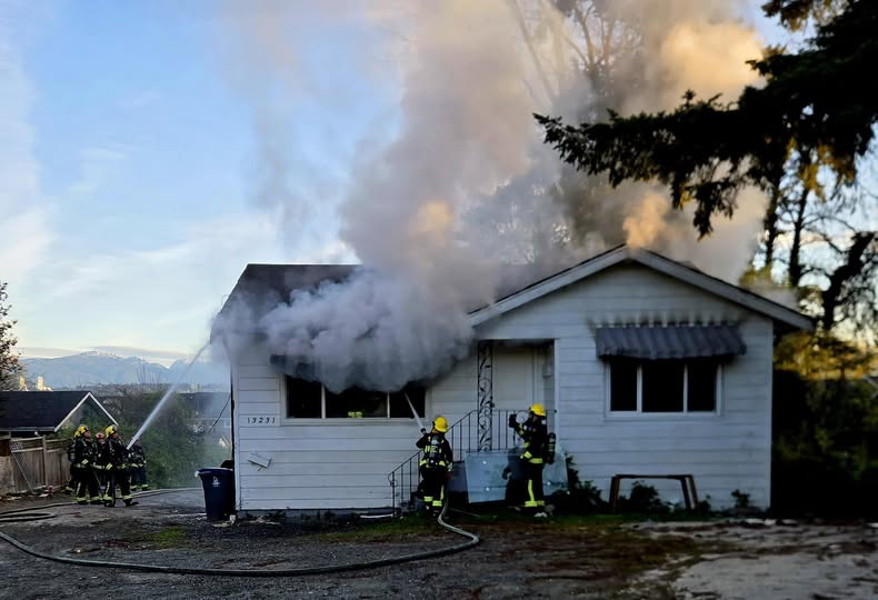 Firefighters responding to residential house fire in North Surrey with heavy smoke