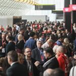 Young teens using smartphones highlighting debate over social media age restrictions in Canada