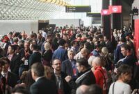 Young teens using smartphones highlighting debate over social media age restrictions in Canada