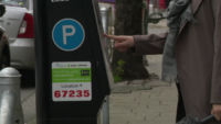 Modern Vancouver parking meter showing digital payment options without coin slot