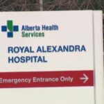 Royal Alexandra Hospital emergency entrance in Edmonton with security presence