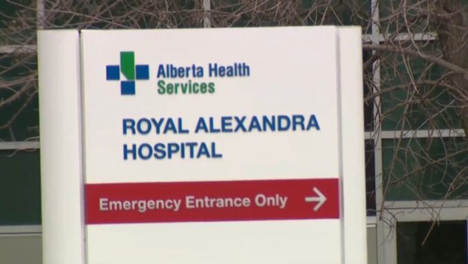 Royal Alexandra Hospital emergency entrance in Edmonton with security presence