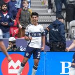 Vancouver Whitecaps players celebrating after scoring against New York City FC in MLS match at BC Place